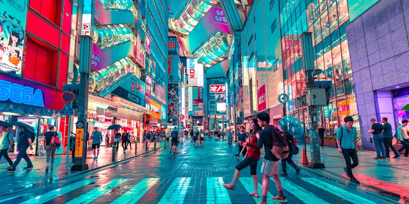 Hire vibe coders in Tokyo - Tokyo skyline with neon lights and Shibuya crossing